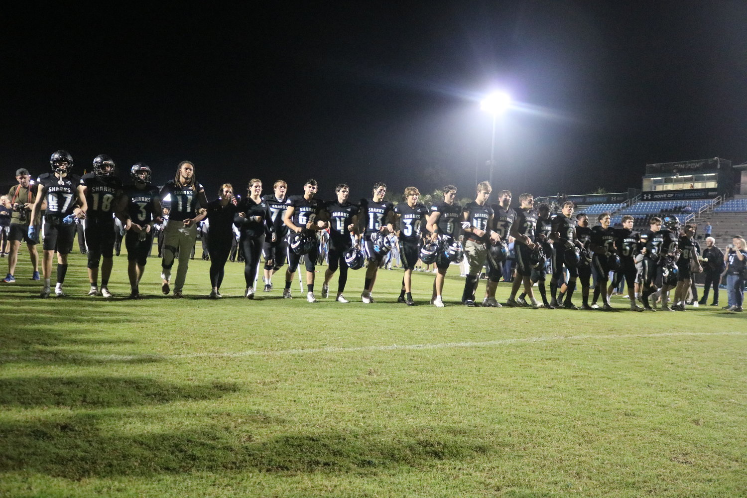 Seniors on the Ponte Vedra football team walk down the field between friends and family for the last time following the team’s senior night contest against Creekside Nov. 4.